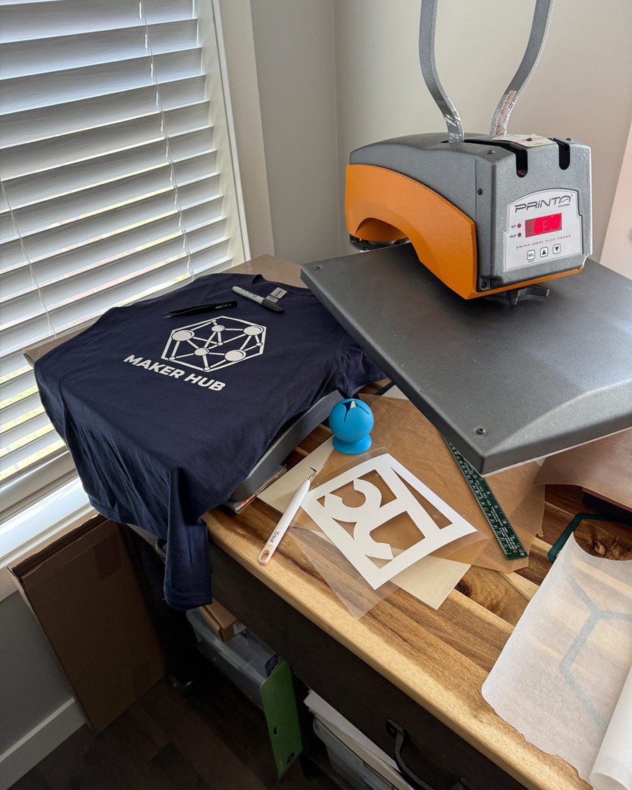 Maker Hub YYC shirt production with heat press